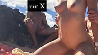 Cuckold lounging on the beach while he makes his wife feel loved
