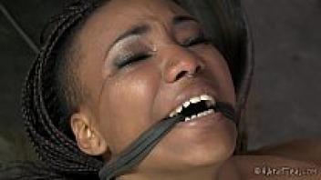 Ebony babe with a flexible body in a lezdom bondage