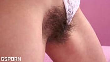 A seductive brunette female who is using dildo in her hairy pussy that is wet.
