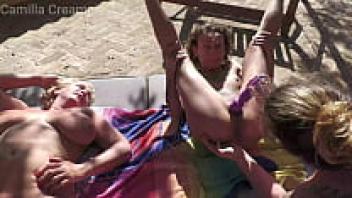 In the sun, a quartet of lesbians squirting together