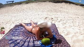 As I was standing on the beach, I changed my clothing in front of the vendor and let him to assist me.