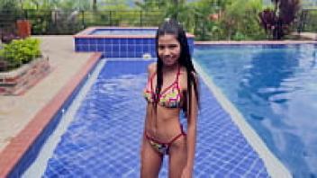 Katherin Moore, a lovely girl, performed a gang bang dap in the pool while she was loved on a sunny day.