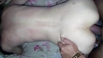 At the same time as he pounded the small girl's ass, he spat on the dick.