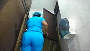 Voyeur: A Latina nurse who is a big ass urinates in a public restroom