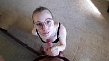 A blonde wearing spectacles gives her boyfriend a sexy blowjob.