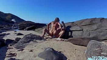 A gorgeous blonde was observed making love on the beach!