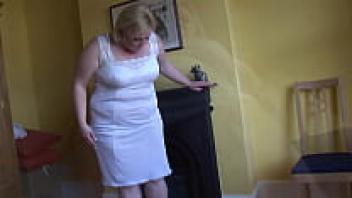 As she cleans, a mature blonde BBW poses and teases.