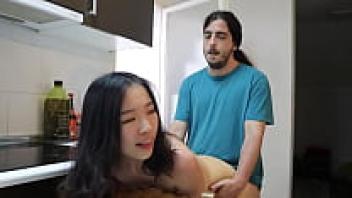 While studying overseas, a Chinese beauty fell in love with a large cock, and when her lover wasn't around, a foreign buddy showered her with affection in the kitchen.