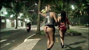 Two naughty girls sucking on the beach and flaunting themselves on the streets