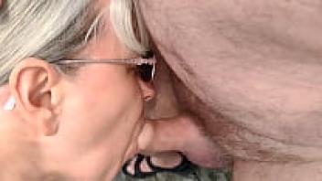 On a public beach, sucking cock