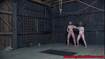 BDSM slaves with tattoos touching one another